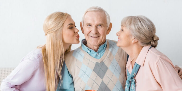 Elderly Man with Female Family Members at an Assisted Living Facility