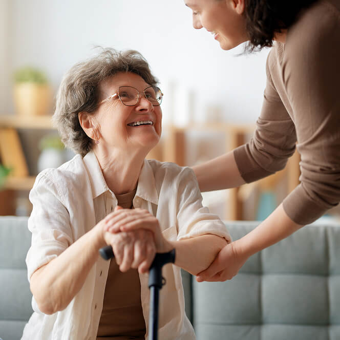 Caregiver Comforting Resident at Memory Care Facility